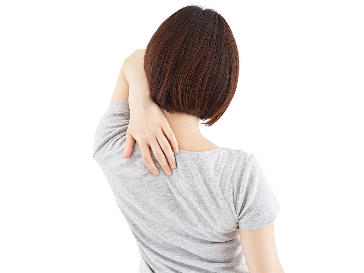 肩甲骨を抑える女性